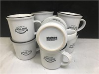 Set of eight solid stoneware mugs. Made by