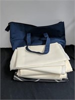 3 sets of curtains in a carrying bag