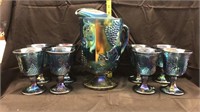 Blue carnival glass pitcher and 8 goblets