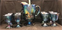 Blue carnvial glass pitcher and 8 goblets