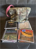 lot of cds with decorative bag