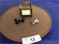 2 mini race cars (1 cast, 1 tin) in display case