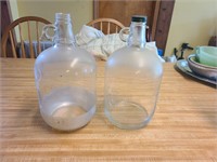 2 one gallon vintage glass jugs