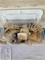 Container of antique buttons and sewing