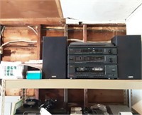 Stereo, speakers, tapes, contents of shelf.