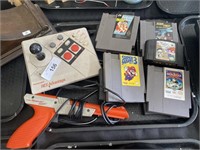 Nintendo NES Advantage controller, gun and games.