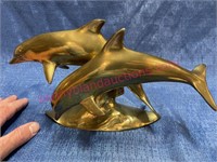 Solid brass dolphins sculpture