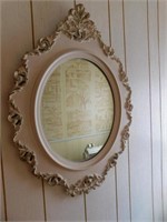Vintage oval mirror in ornate molded plastic