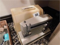 Kenmore portable sewing machine with case