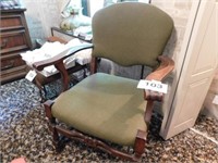 Olive green cloth upholstered arm chair, curved