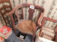 Unusual antique oak chair with curved back that