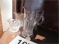Collection of small clear glass pitchers: