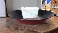 Large red bowl with plastic basket