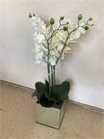 Faux orchid in mirrored pot