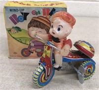 Boy on trike wind-up toy