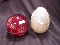 Two large crystal colored paperweights: