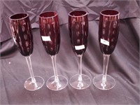 Four cranberry cut overlay champagne flutes,