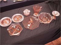 Eight pieces of pink Depression glass, including