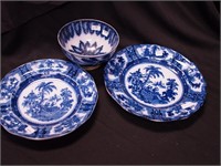 Three pieces of vintage flow blue: two plates,
