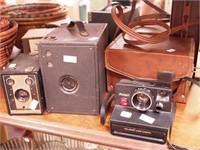Three vintage cameras: Kewpie box, Agfa Ansco