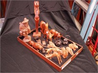Group of wooden carved figurines, mostly of
