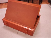 Portable wooden art box with easel and pencils,