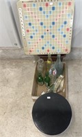 Tin, Bottles, Trash Can And Scrabble Board