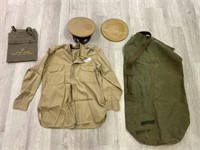 U.S. military uniform jacket, visor, bags.