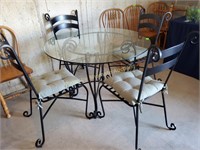 Black wrought iron round glass top table +4 chairs