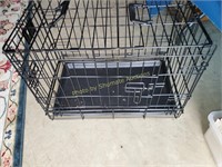 Small black metal dog crate
