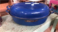 Le Creuset cast iron oven with matching blue