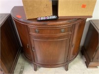 DEMILUNE ACCENT TABLE W CABINET & DRAWER