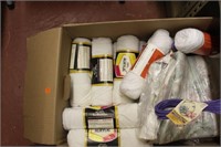 box of white yarn and material