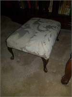Small footstool with metal legs