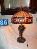 STAINED GLASS LAMP; BRONZE CENTER; WEIGHTED BASE;