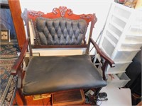 TUFTED BLACK SETTEE WITH APPLIED CARVING ON TOP
