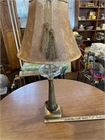 BRASS LAMP WITH GLASS BUBBLE AND TASSLED SHADE