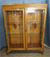 Antique oak bookcase with leaded glass doors