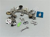 sterling charm bracelet with 26 charms - 85 grams