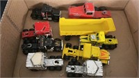 Assorted small toy trucks