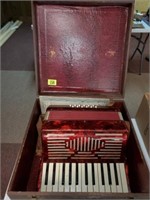 UNMARKED RED ACCORDIAN W/ CASE