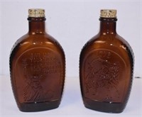 2 Vintage Log Cabin Bottles