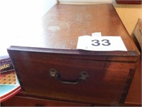 Wooden box on casters, dovetail corners, has