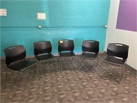 5 Black stacking chairs-new condition