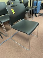 4 black stacking chairs-like new