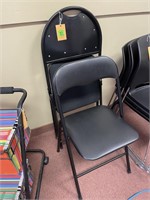 2 black folding chairs