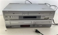 * (2) VHS -DVD players both powered up