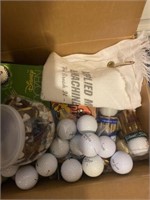 Box of golf balls and tees