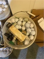 Bucket of golf balls and tees
