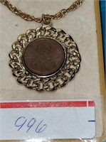 1977 PENNY IN GOLD TONED BEZEL NECKLACE